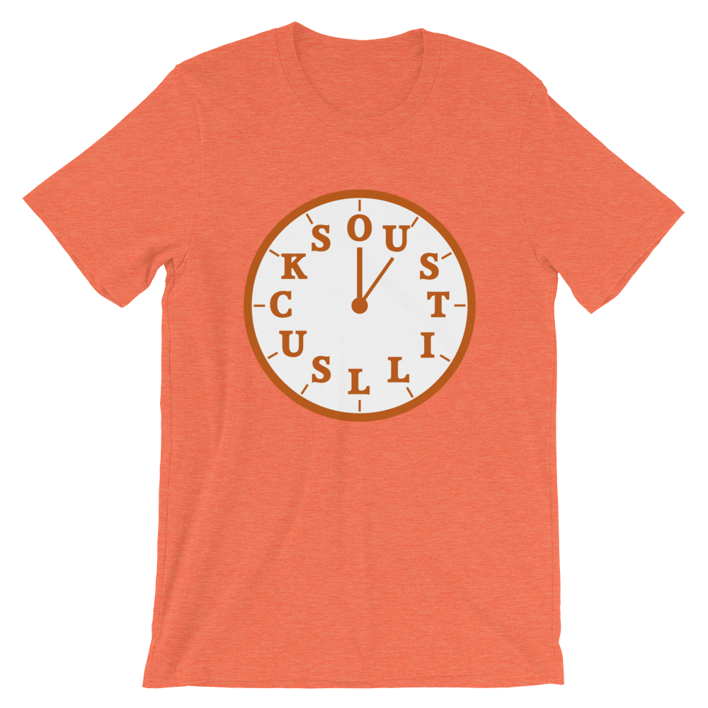 "OU STILL SUCKS" makes up the numbers of a white clock, on orange shirt