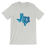"Made" shaped to fit the shape of Texas, on a grey shirt