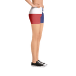 Texas flag pattern shorts on a model below torso, from right